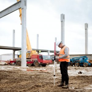 industrial civil engineer working with prefabricated cement pillars